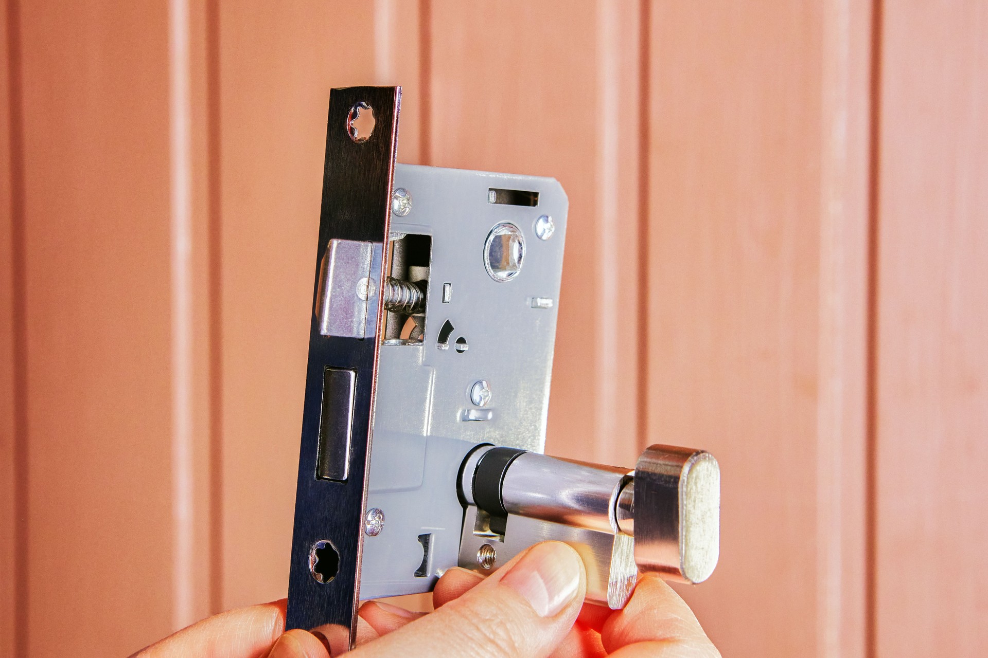 Installing mortice lock on residential door for added security.